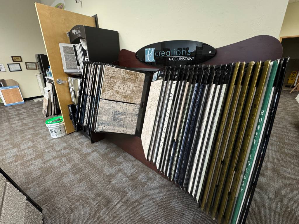 Carpet sample swatches display at The Flooring Store & More in Tucson, AZ showcasing flooring textures and colors