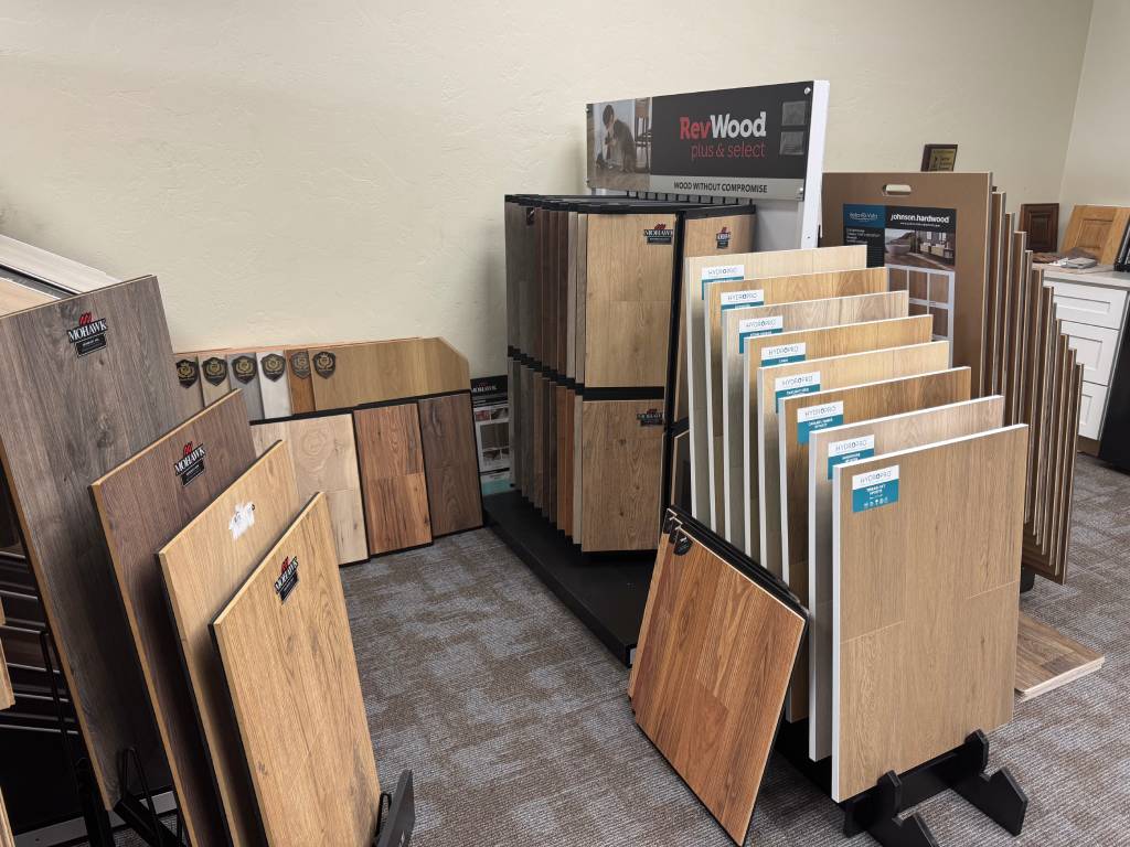 Hardwood flooring samples and swatches display with RevWood and Mohawk brands at The Flooring Store & More Tucson showroom
